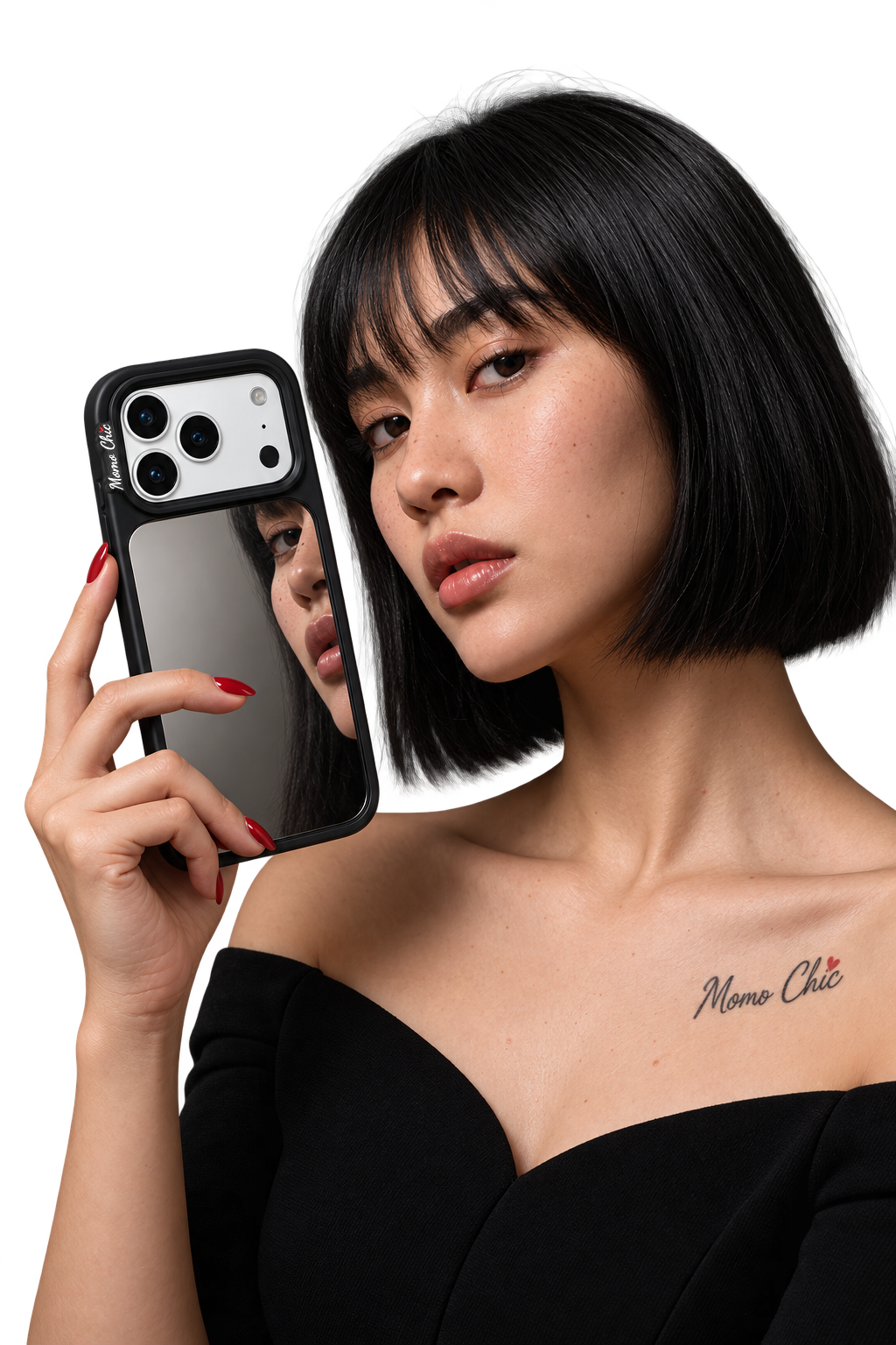 A woman holding a mirrored phone case and looking into the camera